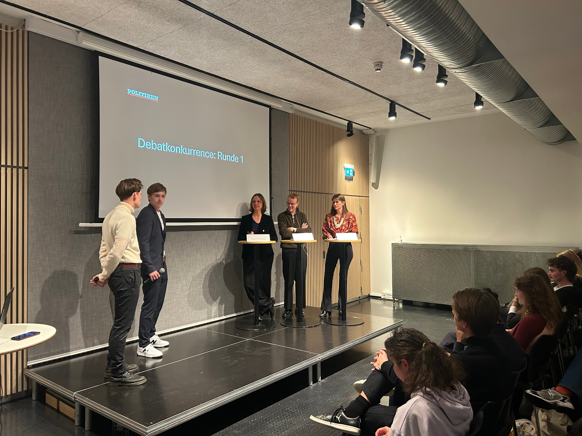 Jonathan Jungfalk on stage at the Politiken debate competition